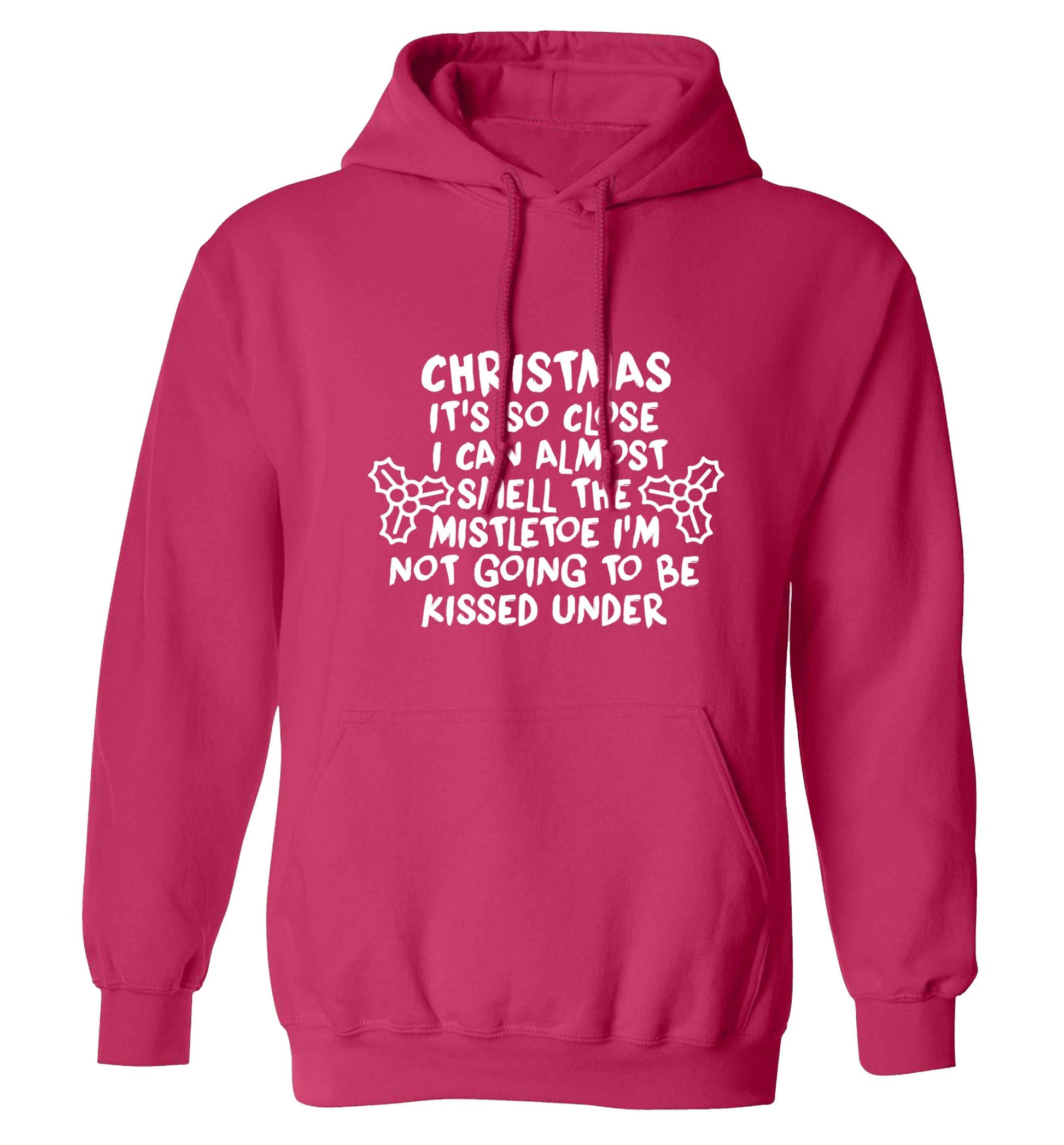 Christmas it's so close I can almost smell the misteltoe I'm not going to be kissed under adults unisex pink hoodie 2XL