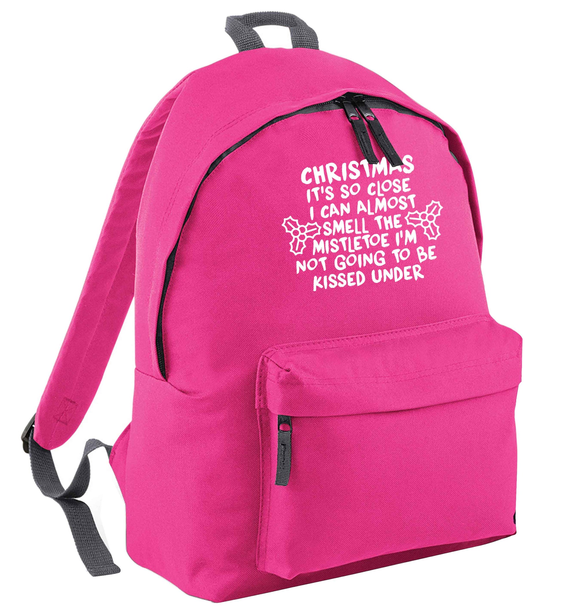 Christmas it's so close I can almost smell the misteltoe I'm not going to be kissed under pink adults backpack