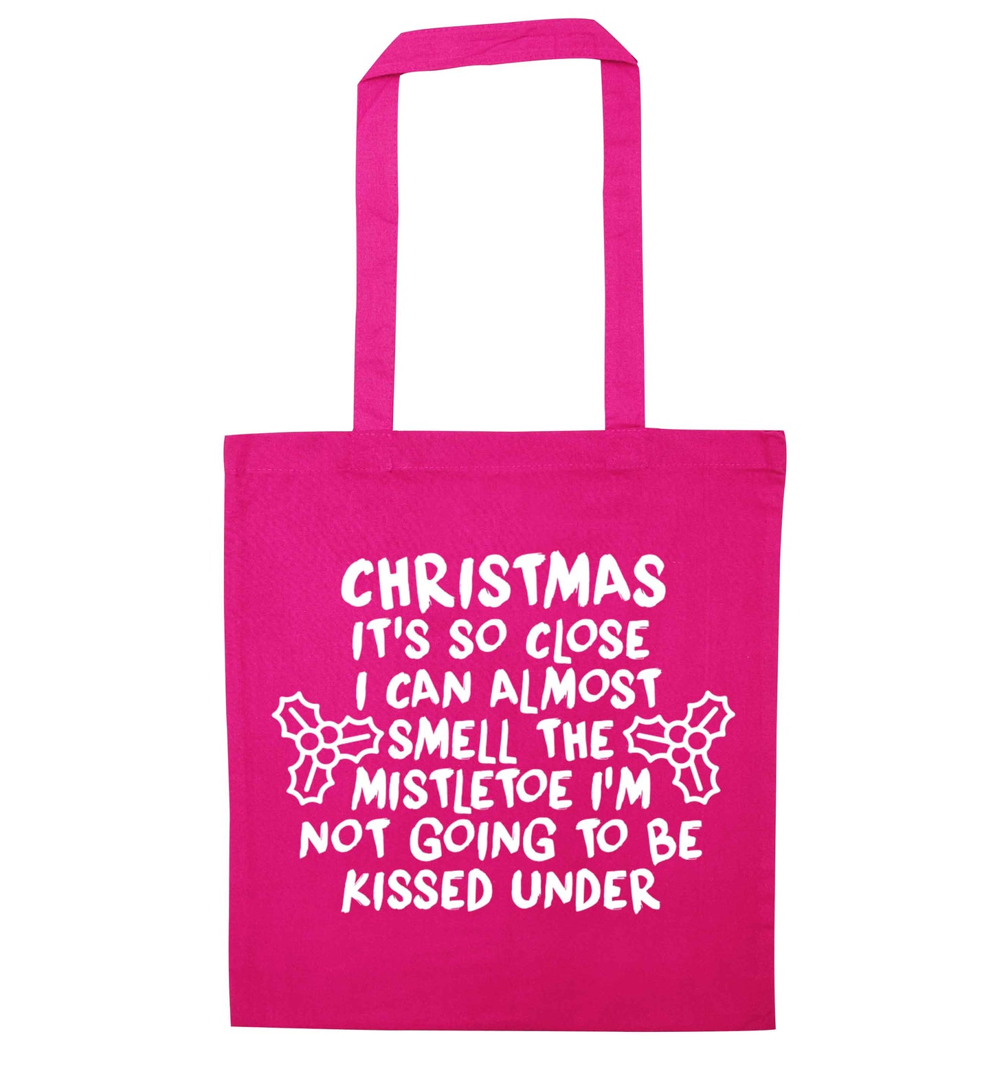 Christmas it's so close I can almost smell the misteltoe I'm not going to be kissed under pink tote bag