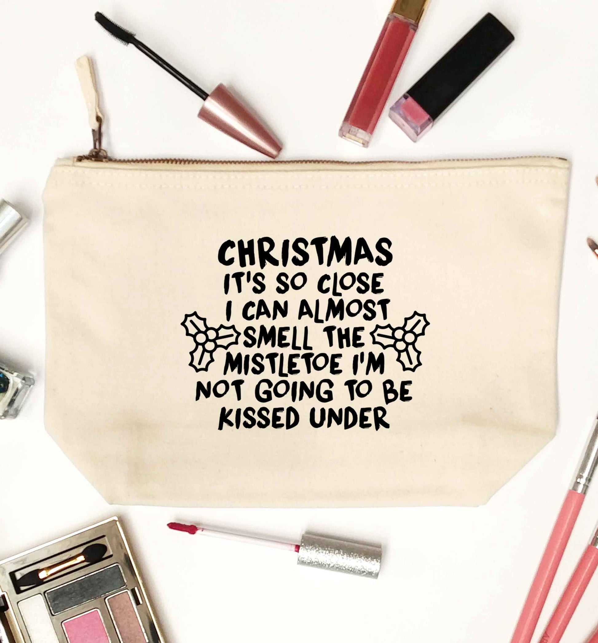 Christmas it's so close I can almost smell the misteltoe I'm not going to be kissed under natural makeup bag