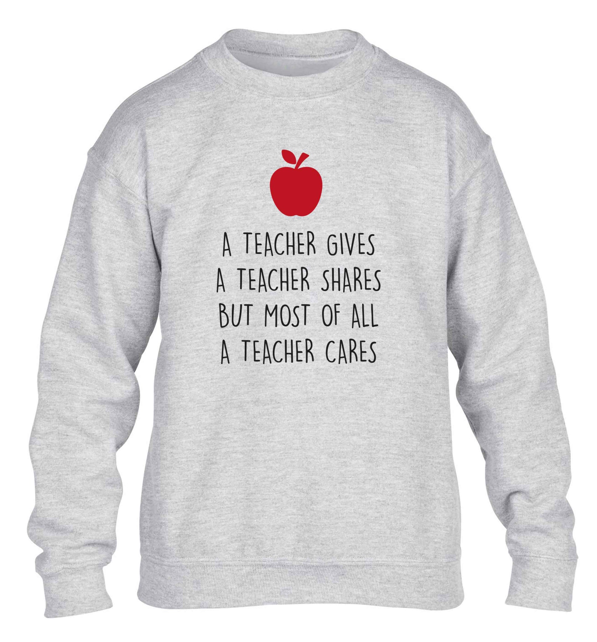 A teacher gives a teacher shares but most of all a teacher cares children's grey sweater 12-13 Years