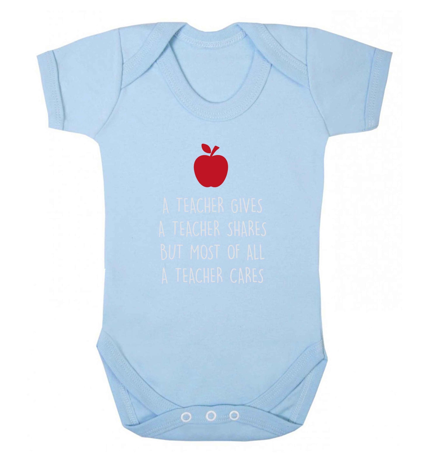 A teacher gives a teacher shares but most of all a teacher cares baby vest pale blue 18-24 months