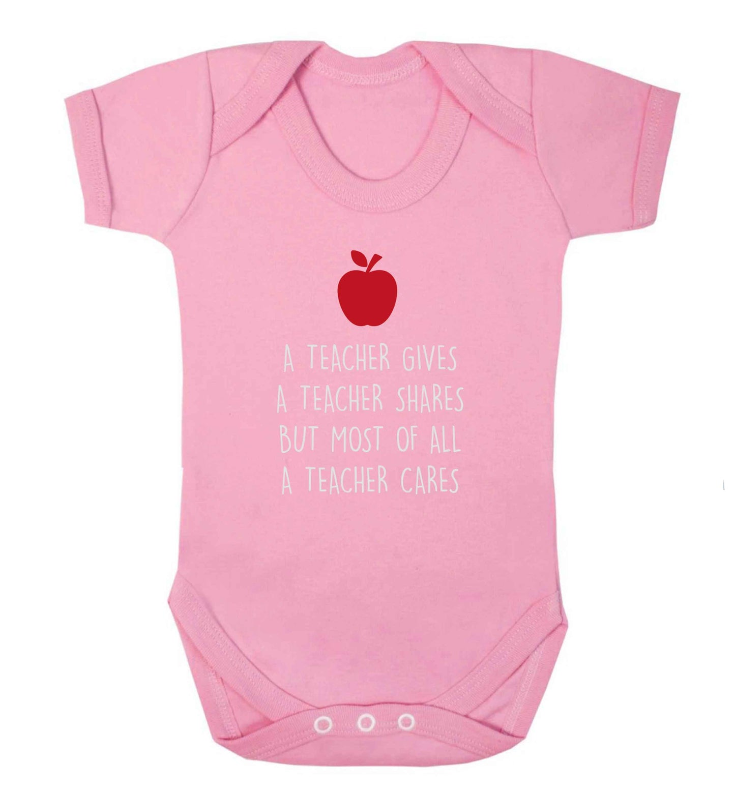 A teacher gives a teacher shares but most of all a teacher cares baby vest pale pink 18-24 months