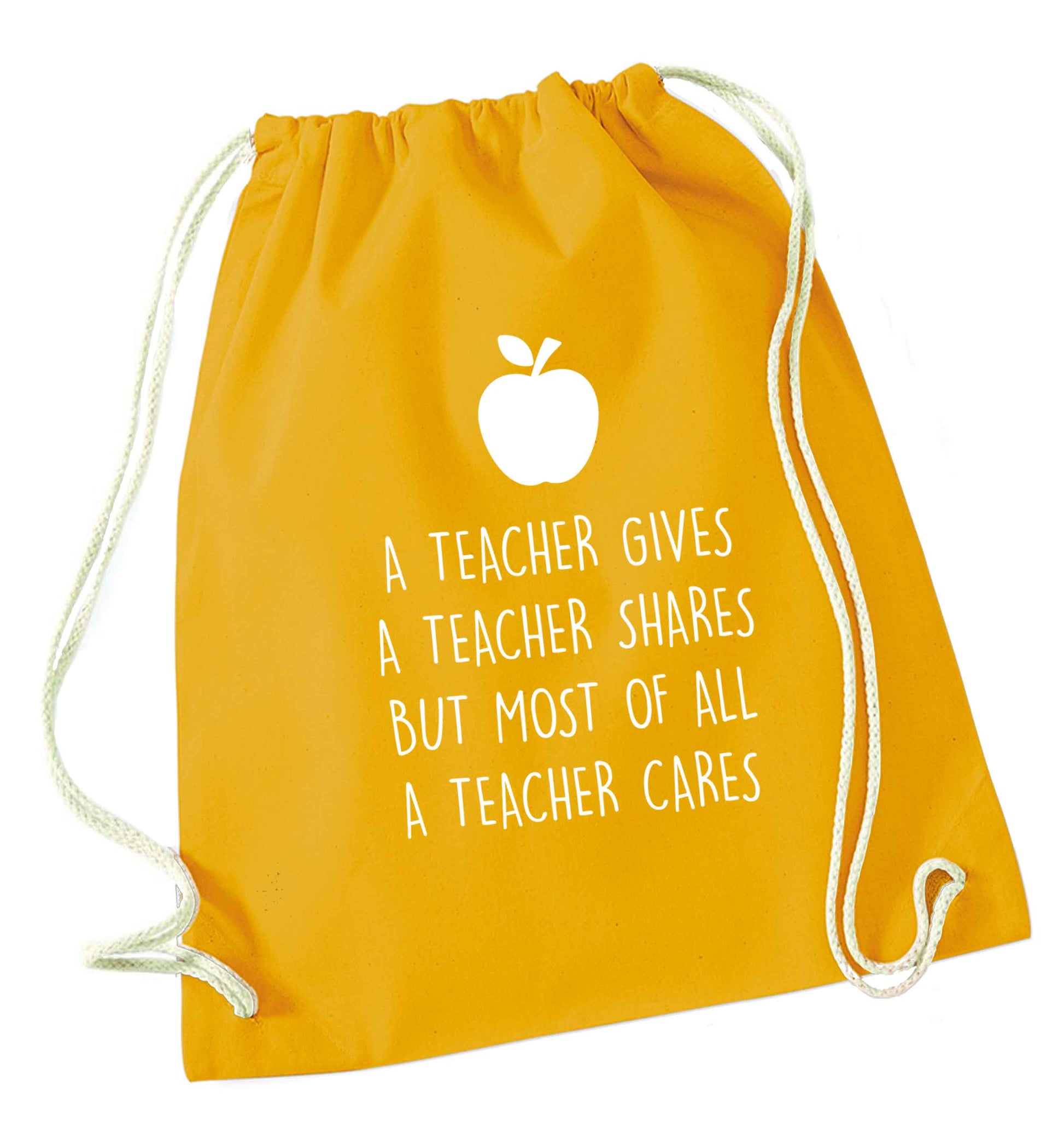 A teacher gives a teacher shares but most of all a teacher cares mustard drawstring bag