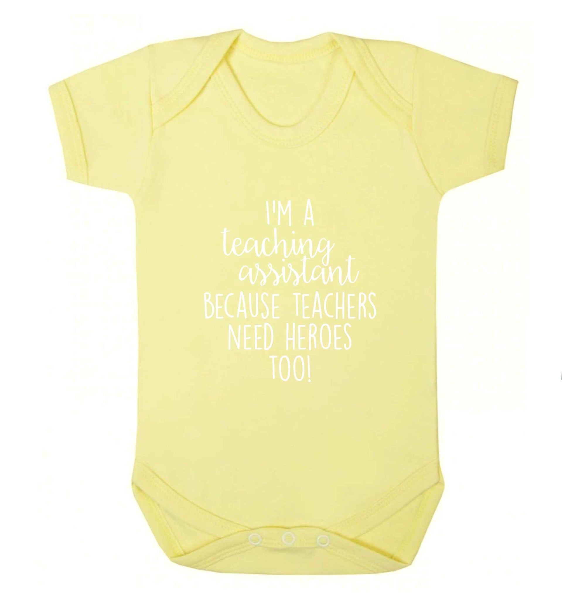 I'm a teaching assistant because teachers need heroes too! baby vest pale yellow 18-24 months