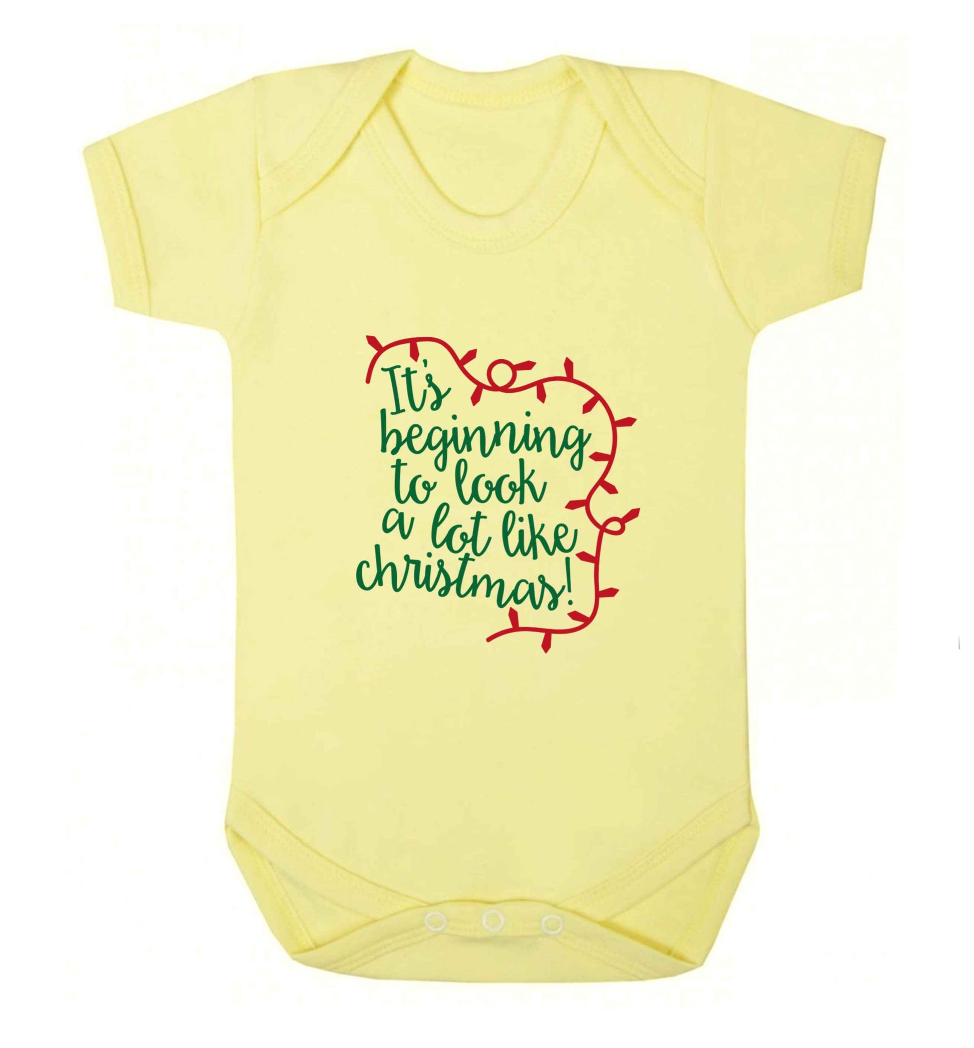 It's beginning to look a lot like Christmas baby vest pale yellow 18-24 months